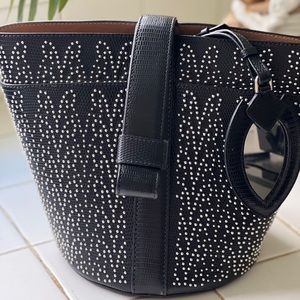 alaia studded wrist bag